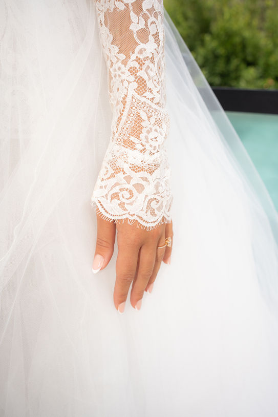 Lace sleeve detail from bridal gown photographed in Mallorca