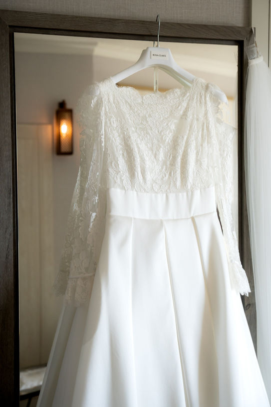 Rosa Clará wedding dress hanging during bridal preparations in Mallorca.