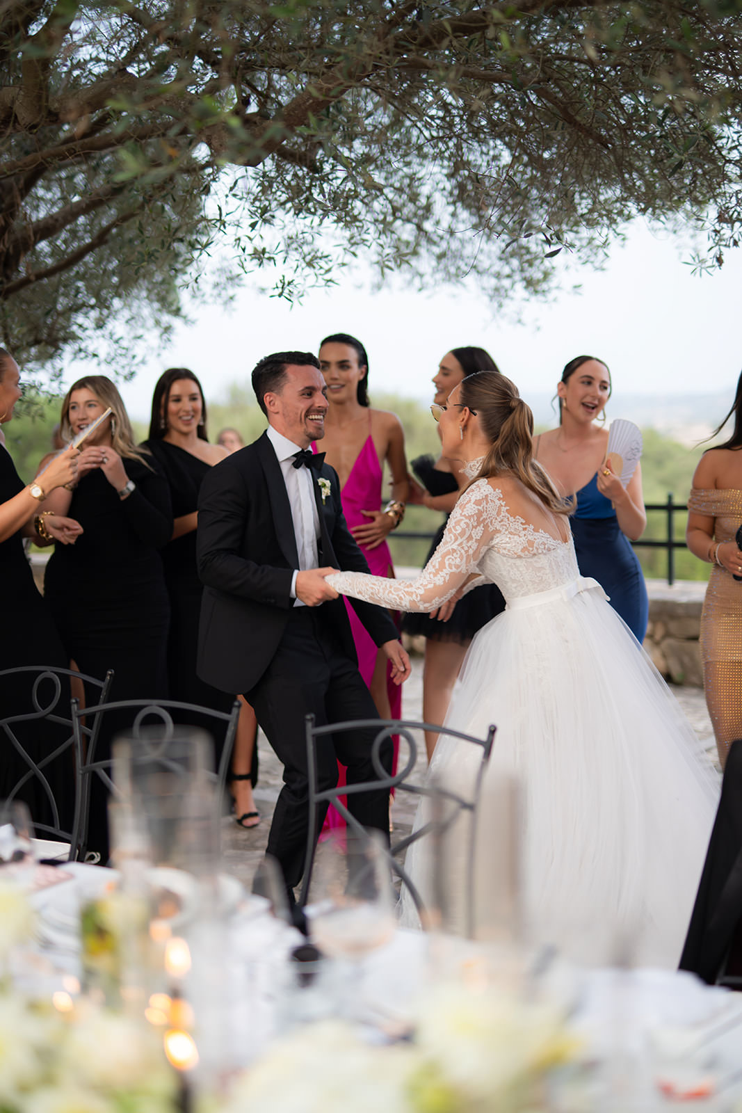 Bride and groom laughing with guests at wedding reception party in Finca Serena