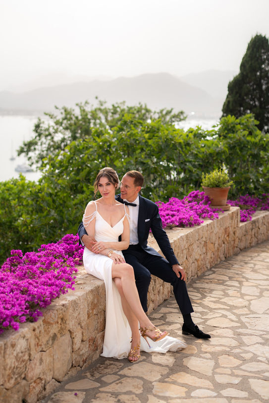 Couple with flowers at La Fortaleza Mallorca wedding, a wonderful sea view venue