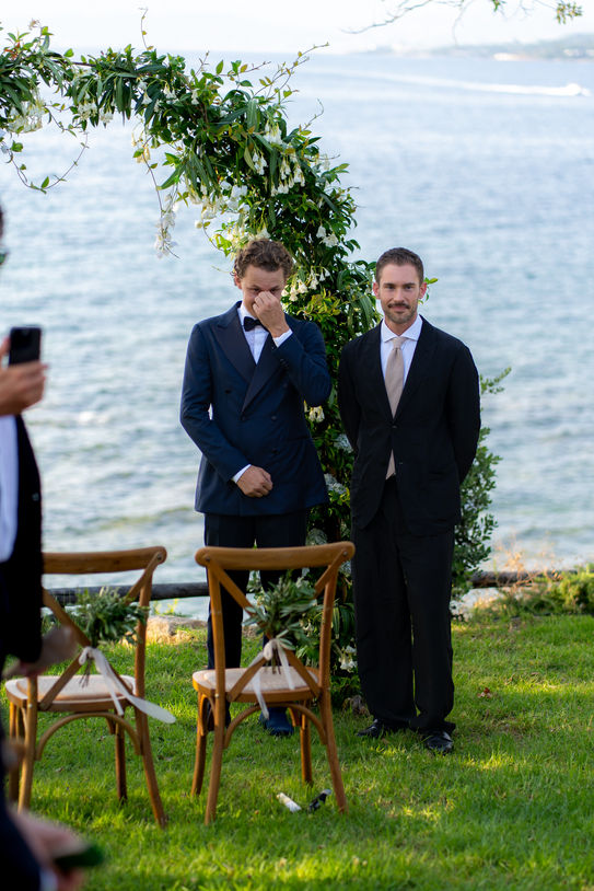 Groom waiting during destination wedding ceremony in Corsica.