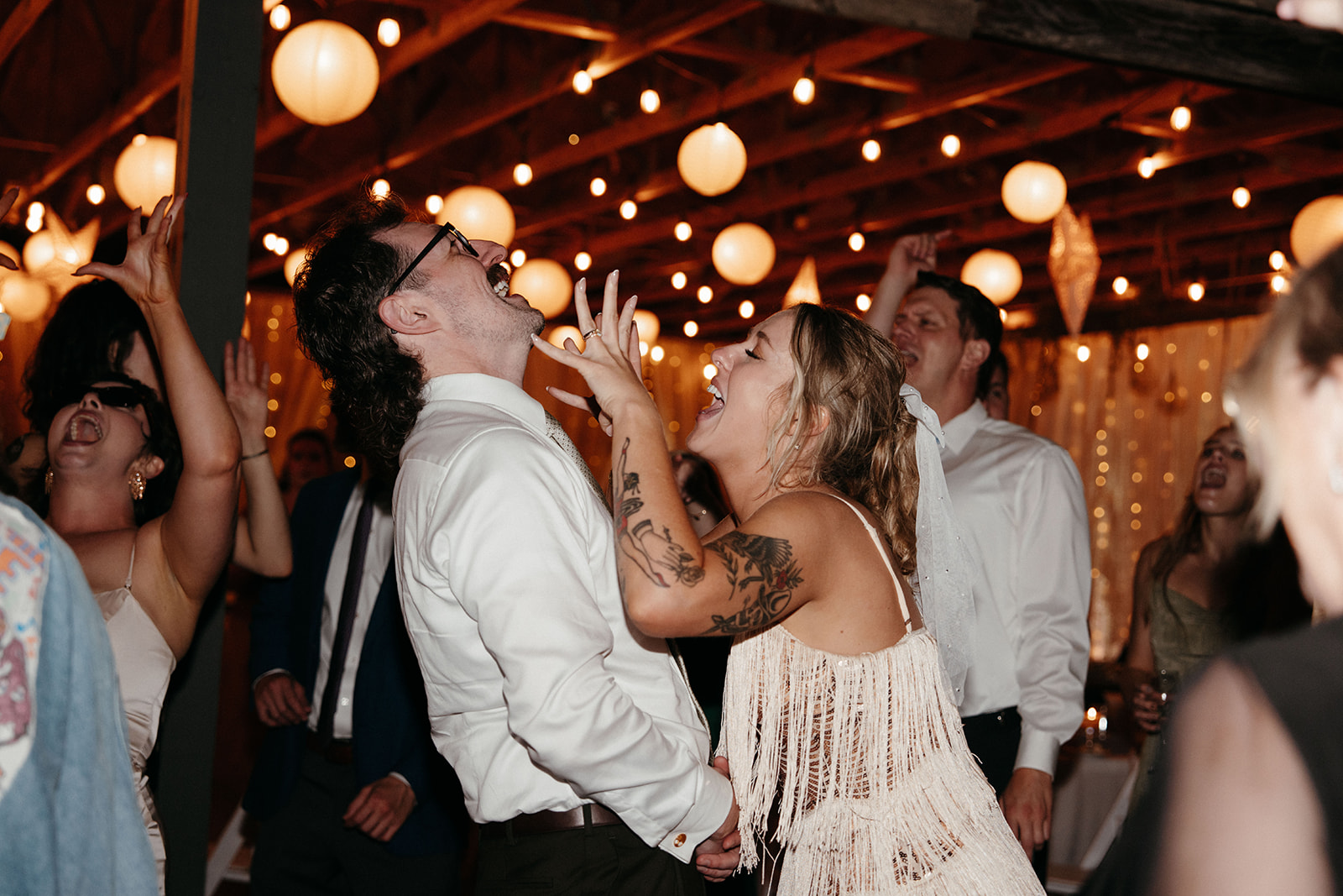 Wedding reception dance floor packed with guests