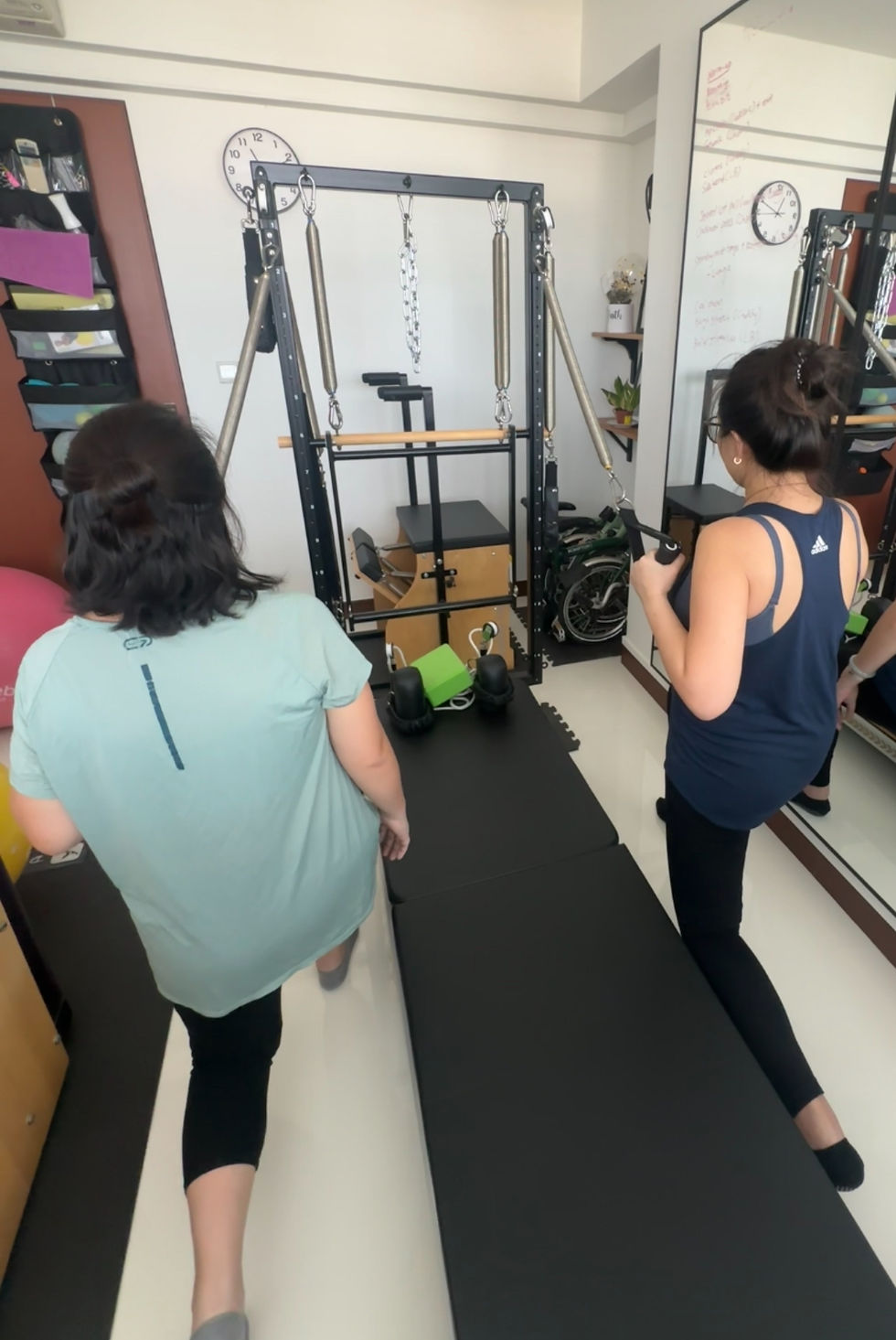 Two glowing mummies in a Duet Pilates session