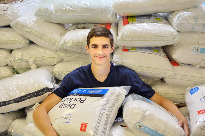 Sixteen-year-old John Shuster’s pillow collection campaign provided 89 new, standard pillows for the residents at Kennedy Home in Kinston.