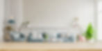 wood-table-top-blur-living-room-have-sofa-armchair-3d-rendering_41470-4146.jpg