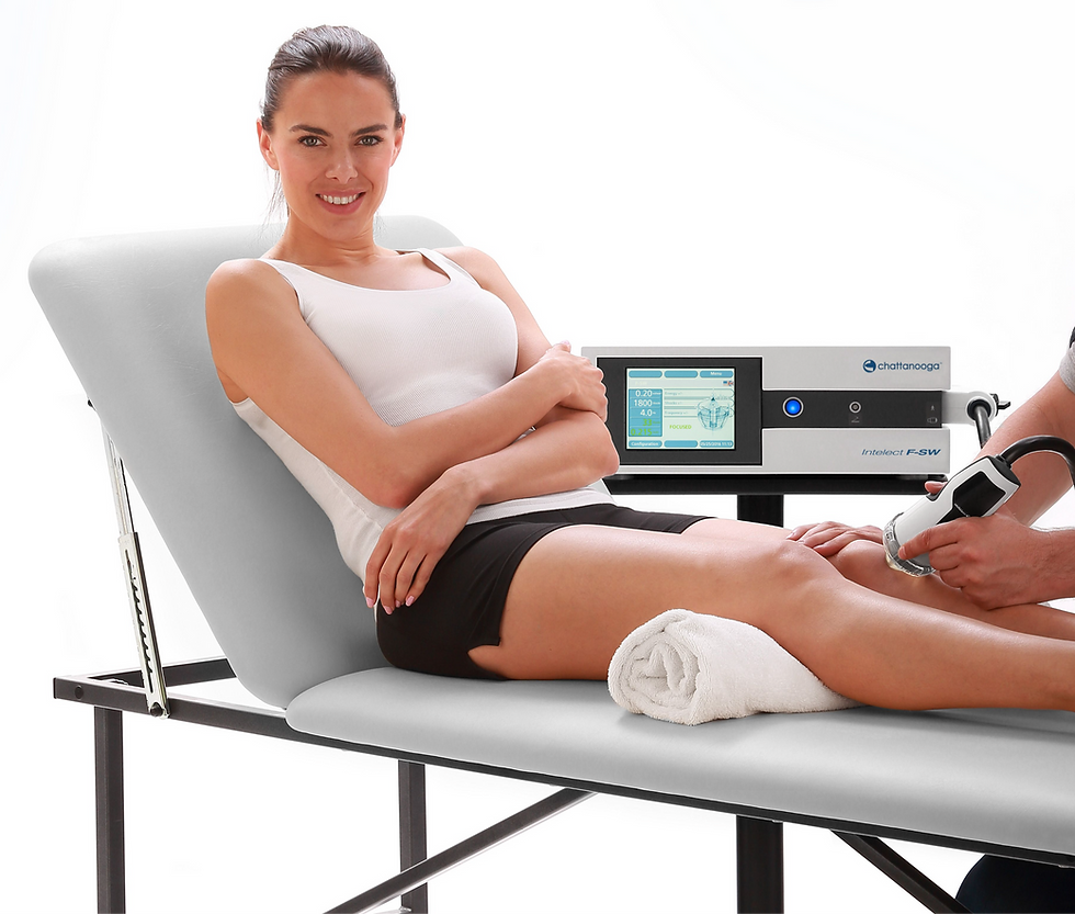 Patient receiving shockwave therapy on her knee during a physical therapy session.
