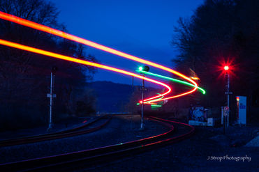 Searchlight signals and Amtrak train at Tivoli