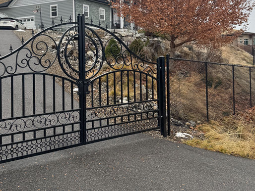 Ornamental metal automated gate installed by blue rhino fence in vernon