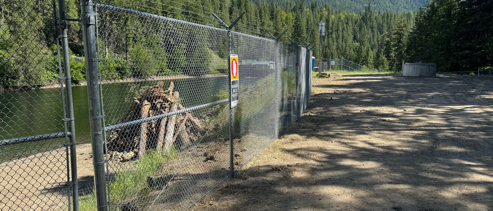 access gate in chain link security fence Blue Rhino Fence built for the dam in Enderby BC