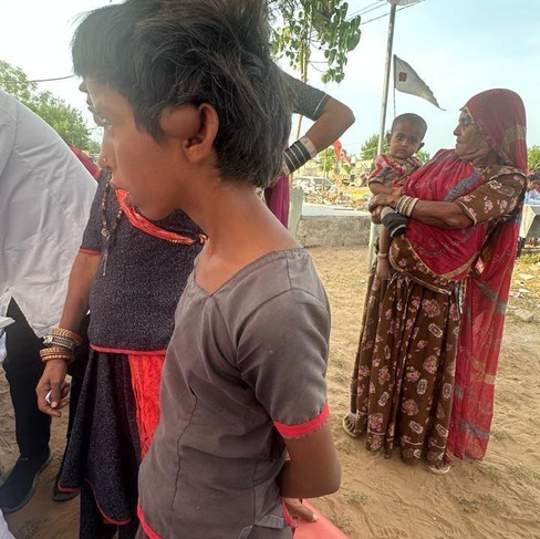 Shy young girl, smiling with her dad, who is also smiling