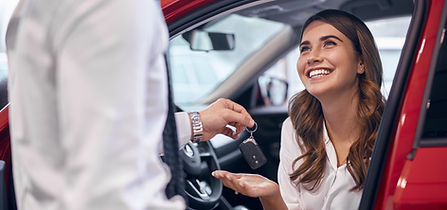 Dealer giving keys to happy customer