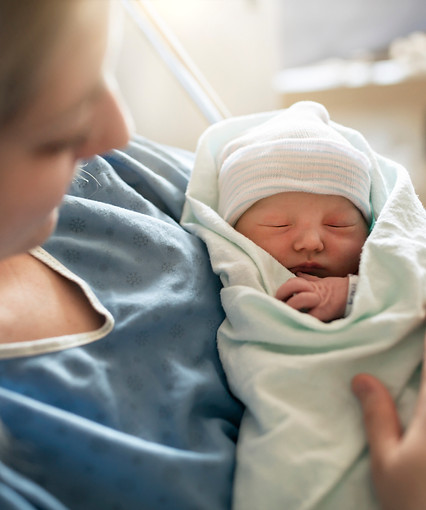 Mother with her newborn baby at the hospital a day after a natural birth labor