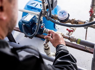 Technician checking water system nodes