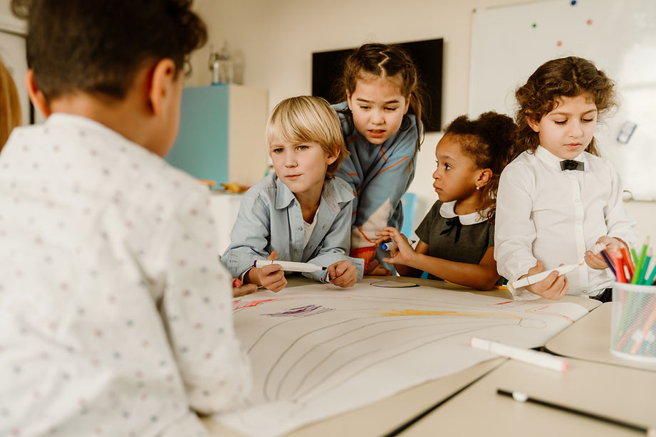 Diverse school-age children collaborating on a project.