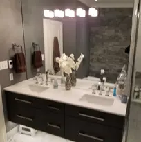 Renovated bathroom with black cabinets