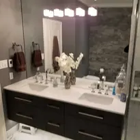 Renovated bathroom with black cabinets