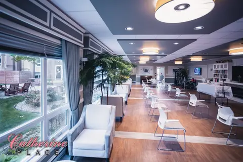 Spacious leisure room with comfortable seating and large windows