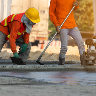 Concrete road construction workers, Construction worker team