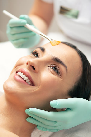 Excited woman revealing her teeth while smiling at cosmetic procedure