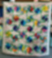 Vibrant quilt with colorful pinwheel patterns