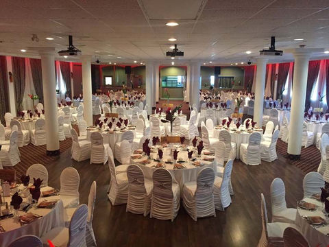 Empty wedding venue with tables and chairs