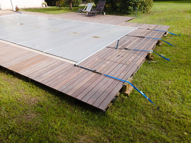 pool which is covered with grey pool tarpaulin