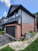 Modern two-story house with brick and siding exterior