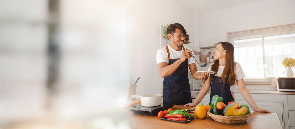 Happy young asia couple cooking together