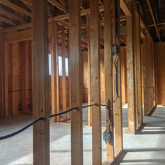 Wooden frame construction of a new building interior.