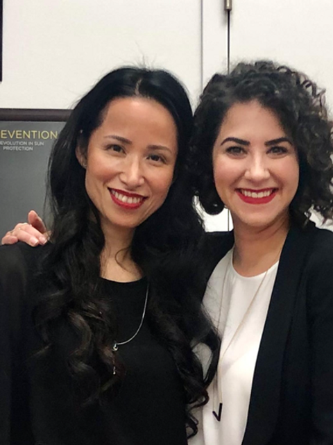 two woman in black clothes