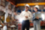 two professional engineer,worker,technician use clipboard discuss work, walk in steel meta
