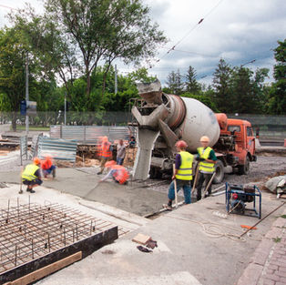 Concrete works for road maintenance construction with many workers and mixer timelapse