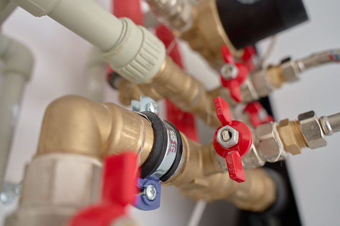 Close-up of brass plumbing valves and pipes