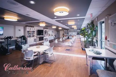 Leisure room with tables, exercise bikes, and TV
