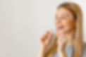 Dental Treatment Concept. Close up of woman with perfect smile holding invisible aligner,