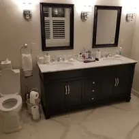 Renovated bathroom with black cabinets