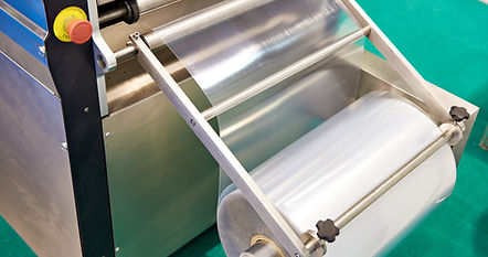 Roll of packaging film on machine food factory