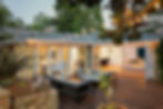Home with furniture patio / wooden deck at twilight