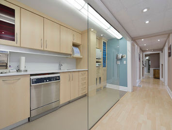 Modern kitchen and hallway with glass partition