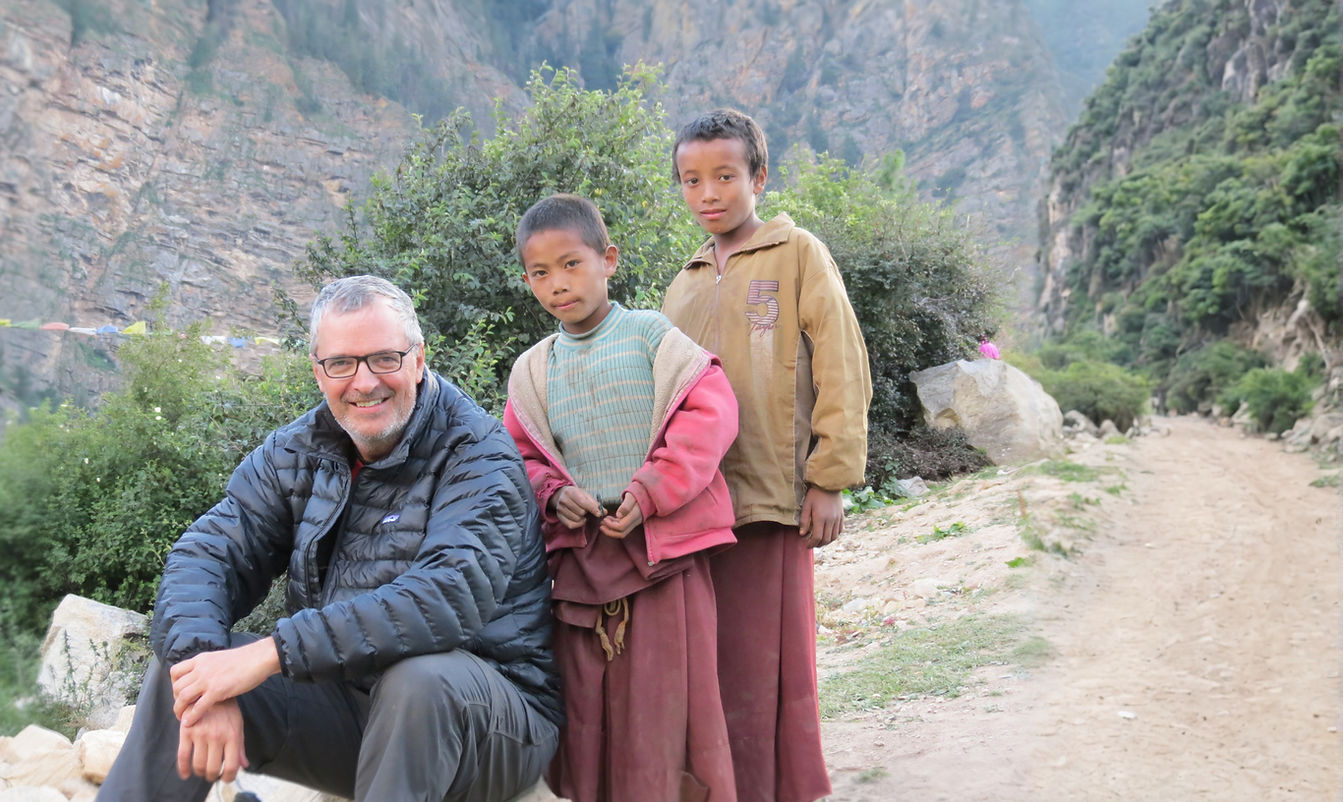 Don and two children on a rural mountain trail.