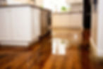 Closeup view of a waterlogged kitchen floor. Water damage to home. Furniture in water.