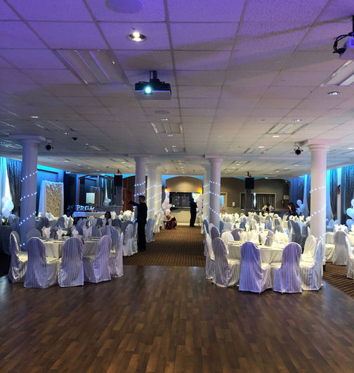 Empty wedding venue with tables and chairs
