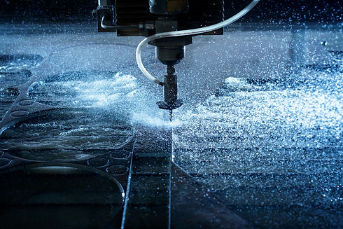 Water jet industrial machine cutting steel plate. Computer controlled metalworking machine