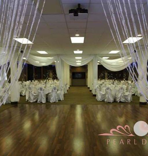 Empty wedding venue with tables and chairs