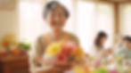 Elder asian woman with flowers