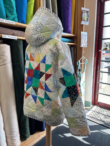 Quilted hooded jacket with colorful star pattern