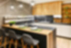 Modern fitted kitchen interior with bar counter