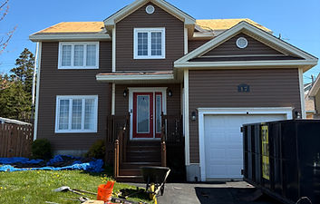 Brown house exterior during roof renovation