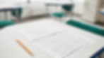 Exam Seat with Verbal Reasoning Assessment answer sheet on the table.