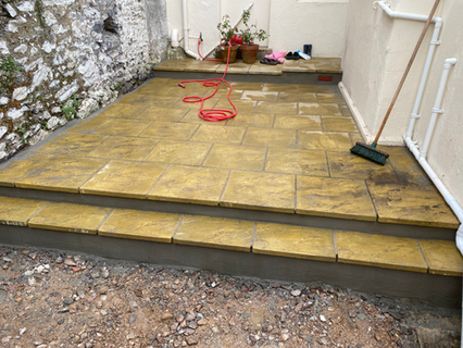 Newly paved patio with two steps